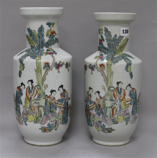 A pair of Chinese famille rose rouleau vases, 20th century, 13.75in. (35cm)